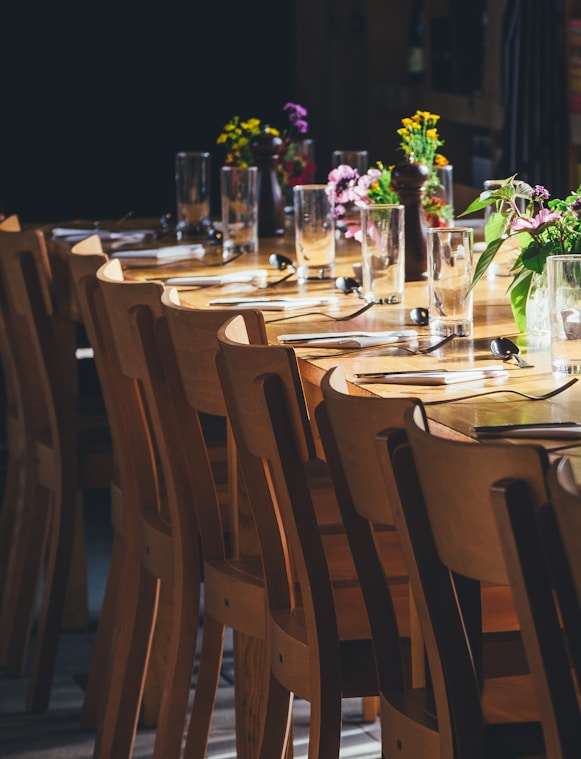 Long table set for a group dinner
